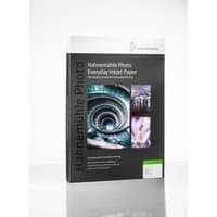 Hahnemühle photo paper pack with spiral staircase, cityscape, and flower images on black and white packaging.