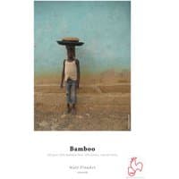 Hahnemühle Bamboo A3 white matte paper with a textured surface, featuring an image of a person balancing a basket.