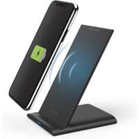 Black Hama QI-FC10S wireless charger with USB port, fast charging, sleek stand design, charging smartphone upright.