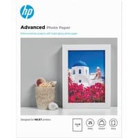 HP Advanced glossy photo paper, 13x18 cm, 25 sheets, with image of a framed Santorini scene on the packaging.