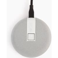 Grey circular Owl Labs conference microphone with textured surface and black cable connection.