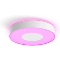 Round white Philips Hue ceiling lamp with pink ambient light and sleek modern design.