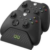 Black Venom TWIN DOCKING STATION with two Xbox controllers, LED charging indicators, and textured surface.