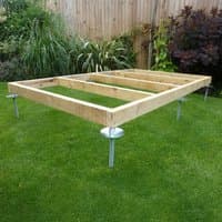 Wooden frame on metal adjustable legs for shed base on grass, part of QuickJACK Kit 3 by ProBASE.