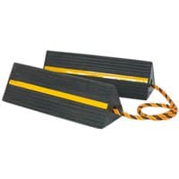 Black rubber wheel chocks with yellow stripe and orange rope handle, triangular shape, heavy-duty design.