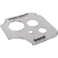Clear acrylic Trend corner and hole template with multiple circular cutouts and printed black text.