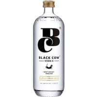 Clear glass bottle of Black Cow Vodka 70cl with gold cap, bold black logo, and text on white label.