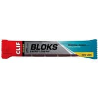 Clif Bar Shot Bloks energy chews, tropical punch flavor, in a red, gray, and blue wrapper with bold black text.