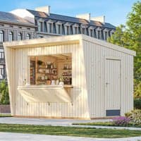 Wooden Palmako Kira garden bar with open serving hatch, light wood finish, and flat roof, set in a garden setting.