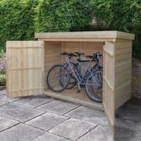 Wooden garden storage with double doors, fits bikes or mower, natural finish, flat roof, set on patio.