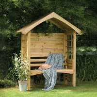 Wooden Forest Cadiz garden arbour seat with slatted back, lattice sides, and pitched roof, adorned with a draped blanket.