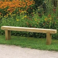 Wooden garden bench with simple design, 6'x1', light brown finish, set on grass with colorful flowers in background.