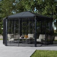 Black mesh netting set for Roma and Monaco gazebos, covering a hexagonal frame with outdoor furniture inside.
