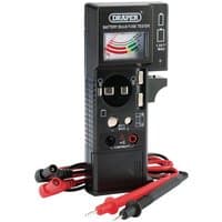 Black Draper tester with analog display, red and black probes, and multiple ports for batteries, bulbs, and fuses.