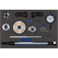 Black and blue Draper Expert engine timing kit with various metal tools and a dial gauge for Audi, SEAT, Skoda, Volkswagen.
