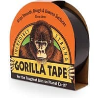 Black Gorilla Tape with orange packaging featuring a gorilla logo and text highlighting strength and surface grip.