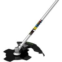 Greenworks brush cutter attachment with silver shaft, black blade guard, and multi-tooth cutting blade.