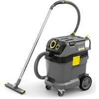 Gray Karcher wet and dry vacuum with yellow accents, large wheels, and flexible hose attached to a metal wand.