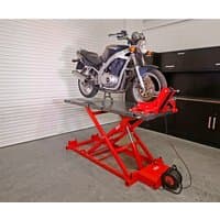 Red Sealey MC680E 680kg electro/hydraulic motorcycle lift with a black bike on top, featuring a scissor lift design.