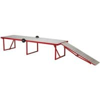 Red Sealey motorcycle workbench with folding design, diamond plate surface, and ramp, 360kg capacity.