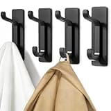 Black self-adhesive hooks, rectangular base, curved hook design, set of four, holding white and beige garments.