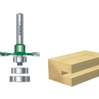 Bearing guided biscuit jointer with silver shaft, green collar, and circular blades next to a wooden joint example.