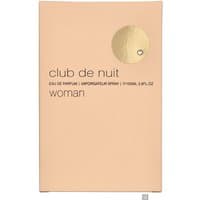Peach-colored Armaf Club De Nuit Woman Eau de Parfum box with gold circular emblem and black text.