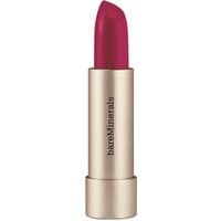 Gold tube of bareMinerals Mineralist Hydra Smoothing Lipstick in vibrant pink shade "Charisma" with smooth finish.