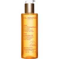 Amber bottle of Clarins Total Cleansing Oil 150ml with white pump and red logo.