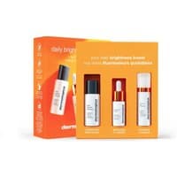 Orange Dermalogica Brightness Booster Kit with three skincare bottles and dropper, designed for all skin types.