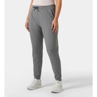 Grey Helly Hansen women's joggers in XL with drawstring waist and tapered legs, paired with white sneakers.