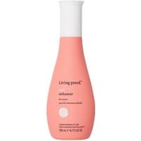 Pink bottle of Living Proof Curl Enhancer, 200ml, with white cap and logo, designed for enhancing curls.