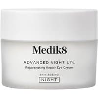 White Medik8 Advanced Night Eye cream jar with black text and a smooth, rounded lid.