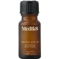 Amber bottle of Medik8 Intelligent Retinol Eye 7ml with black ribbed cap and white text.