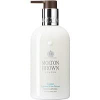 White Molton Brown body lotion bottle with silver pump, Coastal Cypress & Sea Fennel label, 300 ml size.