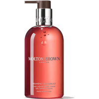Molton Brown Gingerlily Handwash 300ml in a translucent amber bottle with a silver pump and white text.