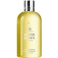 Clear bottle of Molton Brown Orange & Bergamot Bath & Shower Gel with silver cap and elegant label design.
