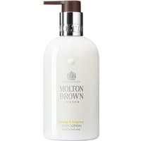 White Molton Brown body lotion bottle with pump, silver logo, and orange & bergamot text, 300 ml size.