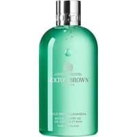 Green Molton Brown shower gel bottle with silver cap, labeled "Wild Mint & Lavandin" in white text, 300 ml size.