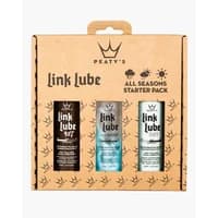 Peaty's LinkLube All Seasons Starter Pack with three bottles in brown cardboard packaging, featuring black and white labels.