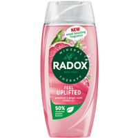 Pink Radox Feel Uplifted shower gel bottle, grapefruit and ginger scent, 225ml, with clear flip-top cap.