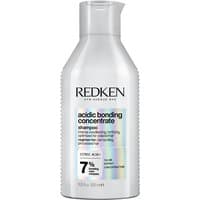 Redken Acidic Bonding Concentrate Shampoo 500ml in a sleek white bottle with black text and a flip-top cap.