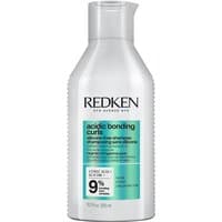 White Redken Acidic Bonding Curls Shampoo bottle, 300ml, with green and black text, featuring a 9% bonding claim.