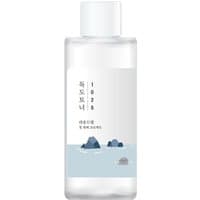 Clear Round Lab 1025 Dokdo Toner bottle with white cap, minimalist label featuring blue sea and island illustration.