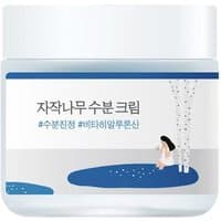 Round Lab Birch Juice Moisturizing Cream in a white jar with blue accents and birch tree illustration, 80ml.