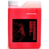 Red Shimano Disc Brake Mineral Oil 1 Litre with black label and white cap.
