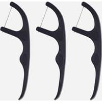 Black dental floss picks with ergonomic handles and whitening floss, set of 50 by Spotlight Oral Care.