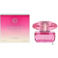 Pink Versace Bright Crystal Absolu perfume bottle with faceted cap, next to matching pink gradient box.