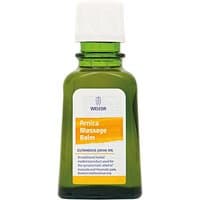 Green glass bottle of Weleda Arnica Massage Balm with white cap and yellow label, 50ml size.
