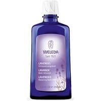 Weleda Lavender Relaxing Bath Milk 200ml in a purple bottle with a white cap and lavender label.